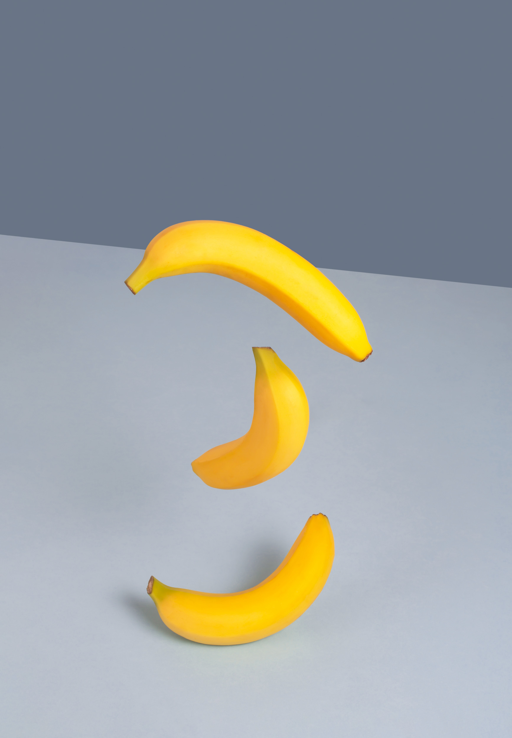 yellow-bananas-on-a-blue-background-minimalistic-2021-08-30-00-04-41-utc